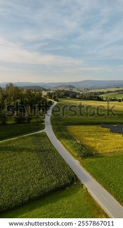 Similar – Foto Bild Ackerland umgeben von grünen Bäumen