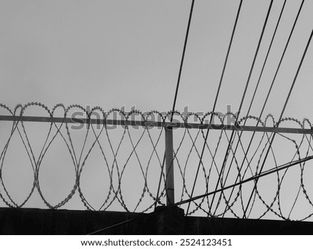 Tense barbed wire metal