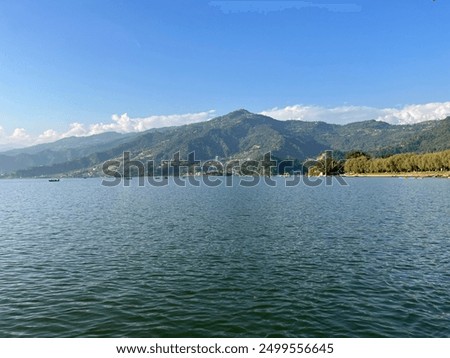 Image, Stock Photo Famous lake side view of Hallstatt village with Alps behind, Foliage leaves framed. Austria