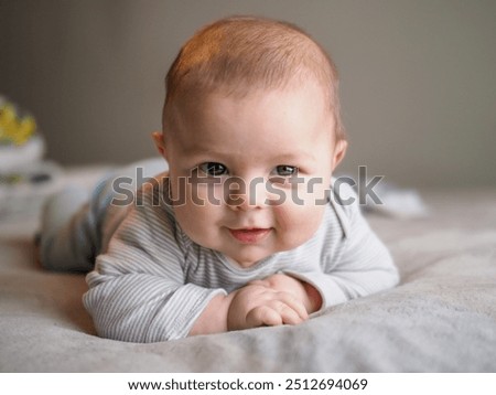 Image, Stock Photo 3 month old baby doing tummy time; bohemian interior room with houseplants