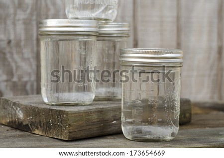 Group of Rustic Mason Jars Filled with Moonshine