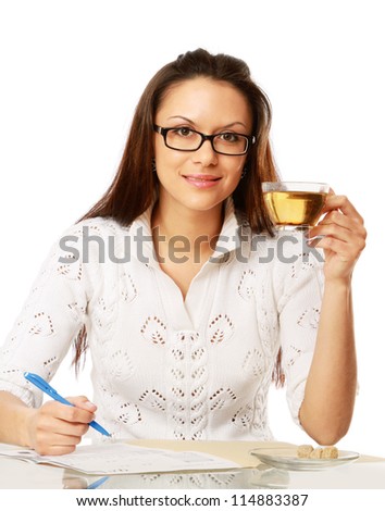 A young businesswoman having tea , isolated on white background