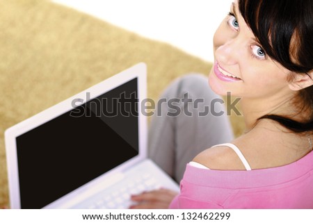 A woman with a laptop sitting on the floor, top view, isolated on white