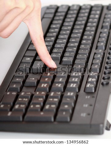 Woman\'s hand on keyboard