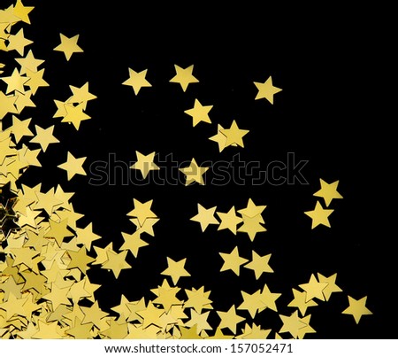 Gold stars on black background