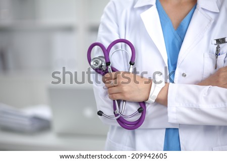 Portrait an unknown young female doctor holding a stethoscope