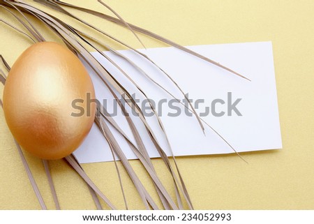 A golden egg, isolated on yellow background