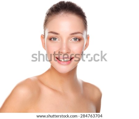 Portrait of beautiful young woman face. Isolated on white background.