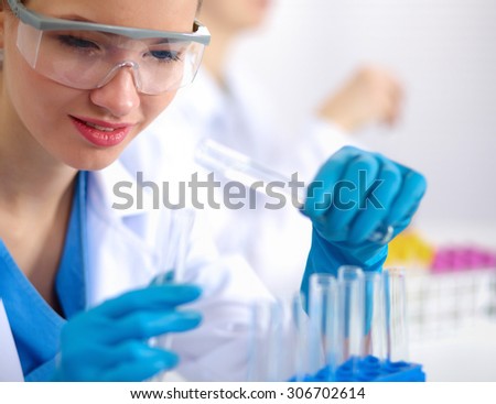 Woman researcher is surrounded by medical vials and flasks, isolated on white background