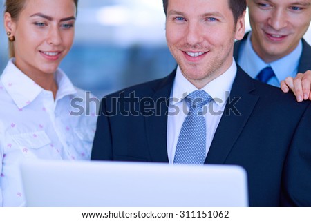 Group of  business people doing presentation with laptop during meeting