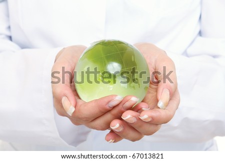 doctor holding plant earth in her hands