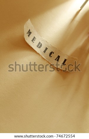 A word medical written on a ripped piece of paper