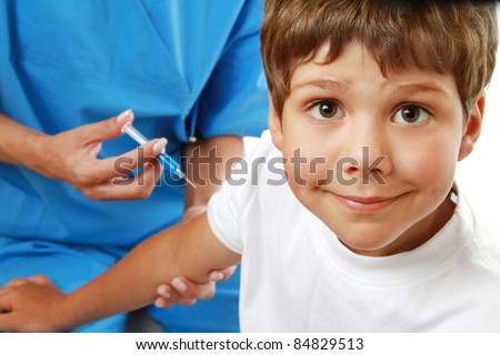 Female doctor making injection to little boy isolated