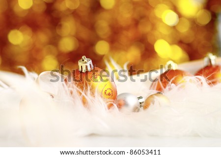 golden christmas ball on a furry background, christmas balls