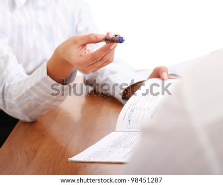 Person signing important document isolated