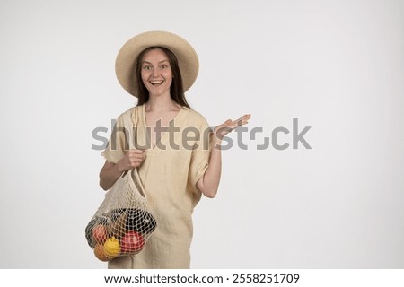 Similar – Image, Stock Photo Cheerful woman with mesh bag full of ripe groceries