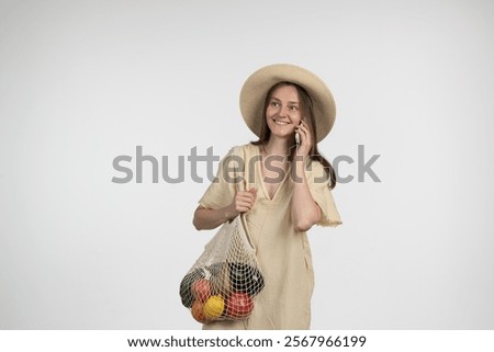 Similar – Image, Stock Photo Cheerful woman with mesh bag full of ripe groceries