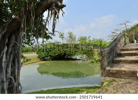 Similar – Image, Stock Photo Old bridge across channel in sunset