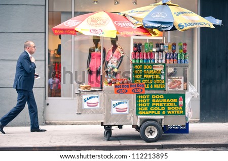 NEW YORK CITY - JUN 24: Food seller in NYC on June 24, 2012. New York City\'s food culture is influenced by the city\'s immigrant history. There are about 4,000 mobile food vendors licensed by the city.