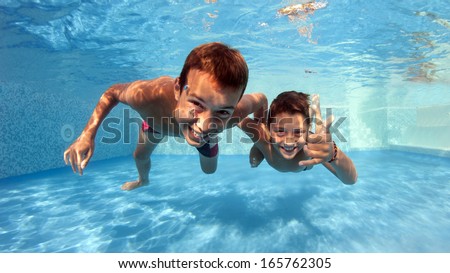 Similar – Image, Stock Photo Underwater body portrait with reflection at the waterline of a young woman under water, standing naked in a pool and bathing