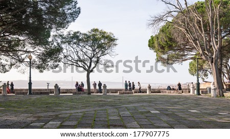 LISBON, PORTUGAL - JANUARY 5, 2014: Tourists looking at the city of Lisbon from the \
