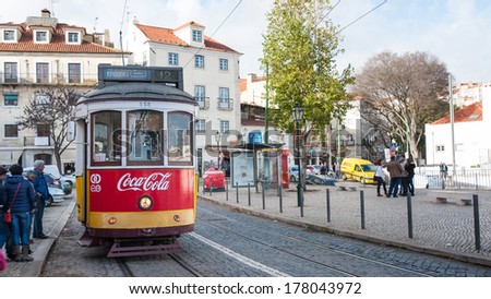 LISBON, PORTUGAL - JANUARY 5, 2014: Traditional tram in Alfama. The Lisbon tramway network is in operation since 1873, it presently comprises five urban lines.