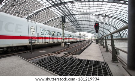 BERLIN - JUNE 2, 2013: People attending trains at the Berlin Central train station. It is the main railway station in Berlin with a surface area of 85 by 120 mt.