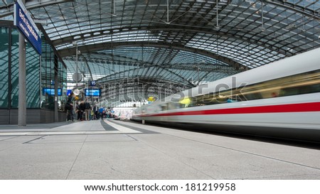 BERLIN - JUNE 2, 2013: People attending trains at the Berlin Central train station. It is the main railway station in Berlin with a surface area of 85 by 120 mt.
