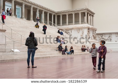 BERLIN - JUNE 3, 2013: Tourists inside the Hall of Pergamon museum, the most visited in Berlin. It hosts more than 1.5 million visitors per year.