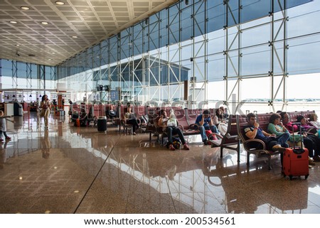 BARCELONA, SPAIN - MAY 30, 2014: Waiting room inside El Prat International Airport. The airport is the second largest in Spain and 31st busiest in the world, and is the main airport of Catalonia.