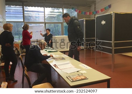 BOLOGNA, ITALY - NOVEMBER 23, 2014: people voting for regional election.