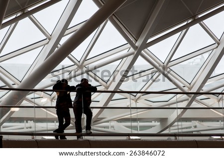 LONDON - APRIL 13, 2013: People silouette inside King's Cross railway station. The annual rail passenger usage between 2011 - 2012 was 27.874 million.