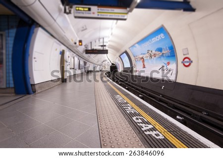 LONDON - APRIL 14, 2013: Mind the Gap sign in Tube Station. The Underground system serves 270 stations and has 402 kilometres (250 mi) of track, 45 per cent of which is underground.
