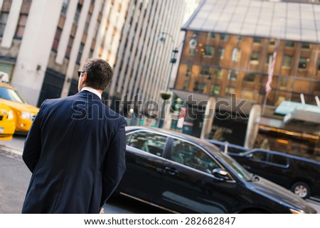Businessman portrait from behind on the streets of Manhattan. New York City.