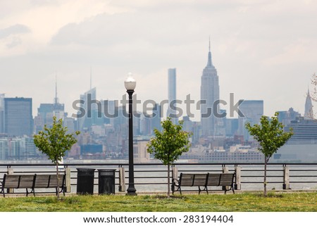 New York City Manhattan skyline over Hudson River viewed from New Jersey Liberty State Park at daytime.