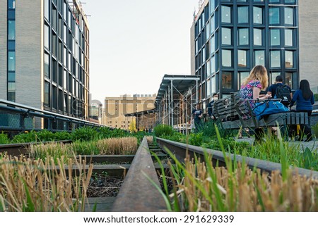 NEW YORK CITY - CIRCA MAY 2015: People walking on the High Line Park. The High Line is a park built on an historic freight rail line elevated above the streets in the West Side.
