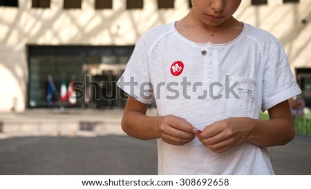 ROVERETO, ITALY - JULY 23, 2015: Mart Museum sticker on kid\'s T-shirt. The Museum of Art of Trento and Rovereto (MART) contains mostly modern and contemporary artworks.