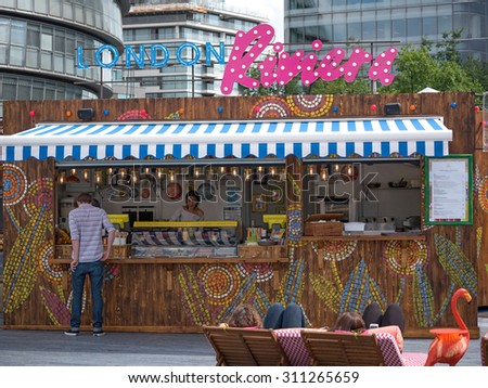 LONDON - JUNE 16, 2015: People enjoying at London Riviera, a pop-up food and drink experience outlet, quite popular among people, a good place to relax.