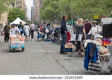 NEW YORK CITY - MAY 16, 2015: Flea market on the street. A flea market (or swap meet) is a type of bazaar that rents space to people who want to sell or barter merchandise and used goods.