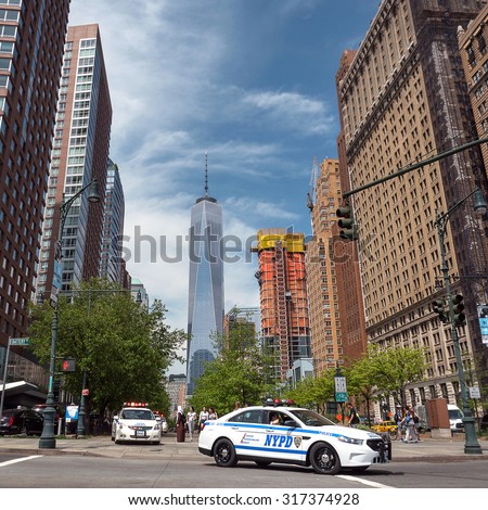 NEW YORK CITY - MAY 12, 2015: NYPD Police car with Freedom Tower in the background. The New York City Police Department is the largest municipal police force in the United States.
