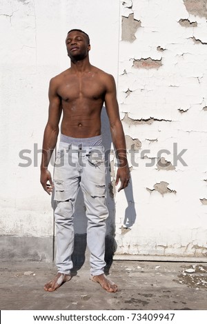 Black muscular man full body portrait.