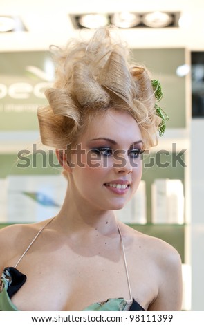 BOLOGNA, ITALY - MARCH 12: Hairstyle at Cosmoprof exhibition, the largest beauty and cosmetic sector trade show in Italy with more than 170.000 attendees on March 12, 2012 in Bologna, Italy.