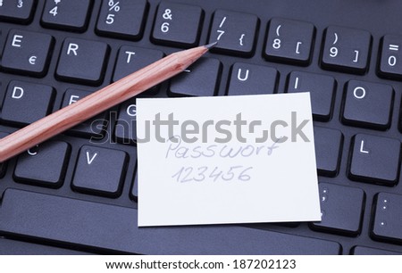 Image shows a computer keyboard wit a password notice