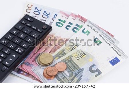 TV remote control and money isolated