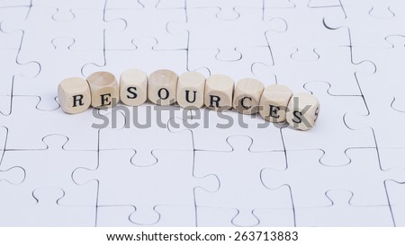 White puzzle with wooden letters \