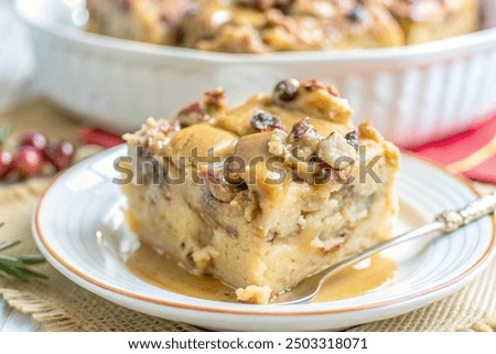 Similar – Image, Stock Photo Sweet bread pudding with orange zest butter