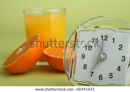 orange juice and alarm clock