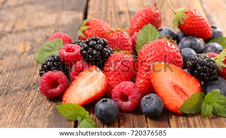 Similar – Image, Stock Photo Red fruits selection with watermelon, pomegranate, strawberries and raspberries at bright background