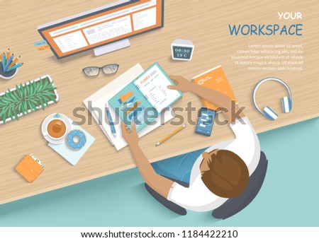 Man sitting at the wooden table. Workplace Desktop Workspace Armchair, office supplies, monitor, books, notebook, headphones, phone, glasses, pen, paper, tea, donuts. Vector Top view 