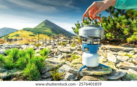 Similar – Image, Stock Photo Kettle placed on campfires in snowy woods at sundown